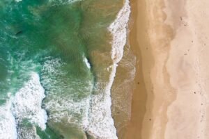 Aerial Drone View of Beach With Waves