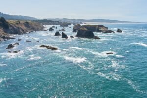 Drone Photography of Ocean Landscape Scenic View of Waves Crashing Around Rocks
