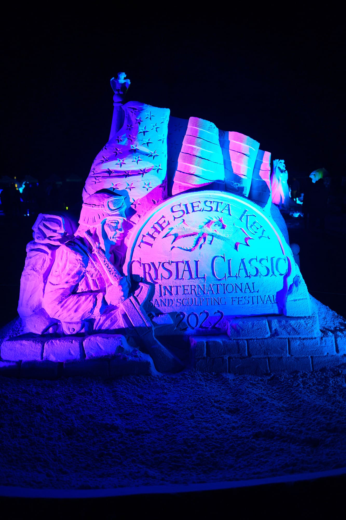 Sand Sculptures lit up and looking magical at The 2022 Siesta Key