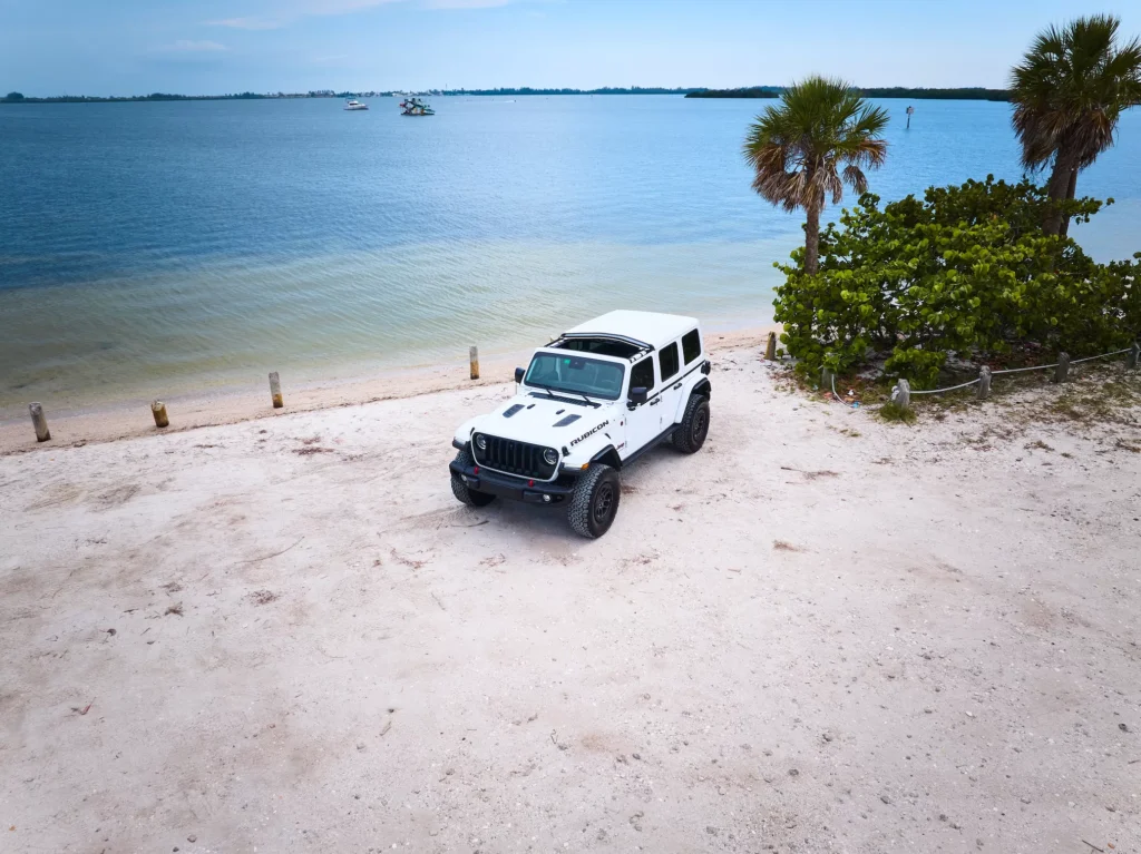 Automotive Photography of a Jeep Wranger in the Sand at Palma Sola Sarasota