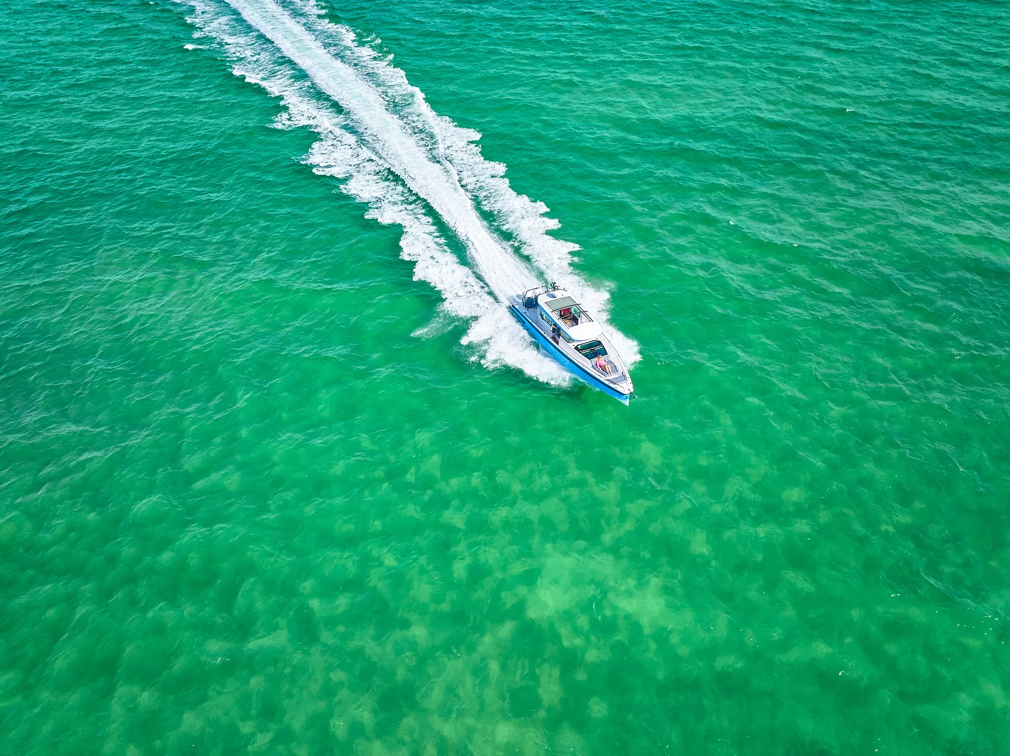 Aerial Drone View of Boat In Gulf Coast Green Tropical Waters Sarasota