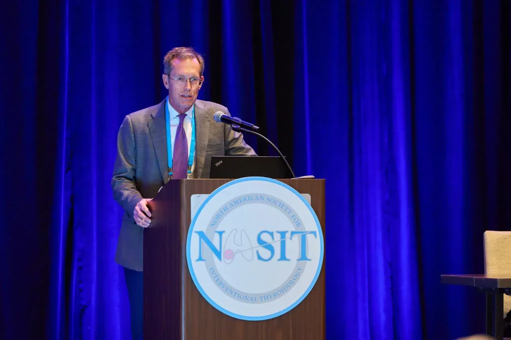 Event Photograph of Professional speaker presenting keynote speech at Sarasota business conference
