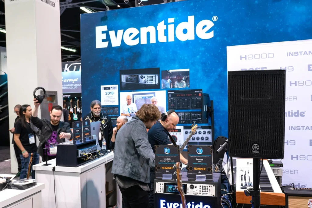 Live event conference photography of crowd networking and trying out instruments at NAMM