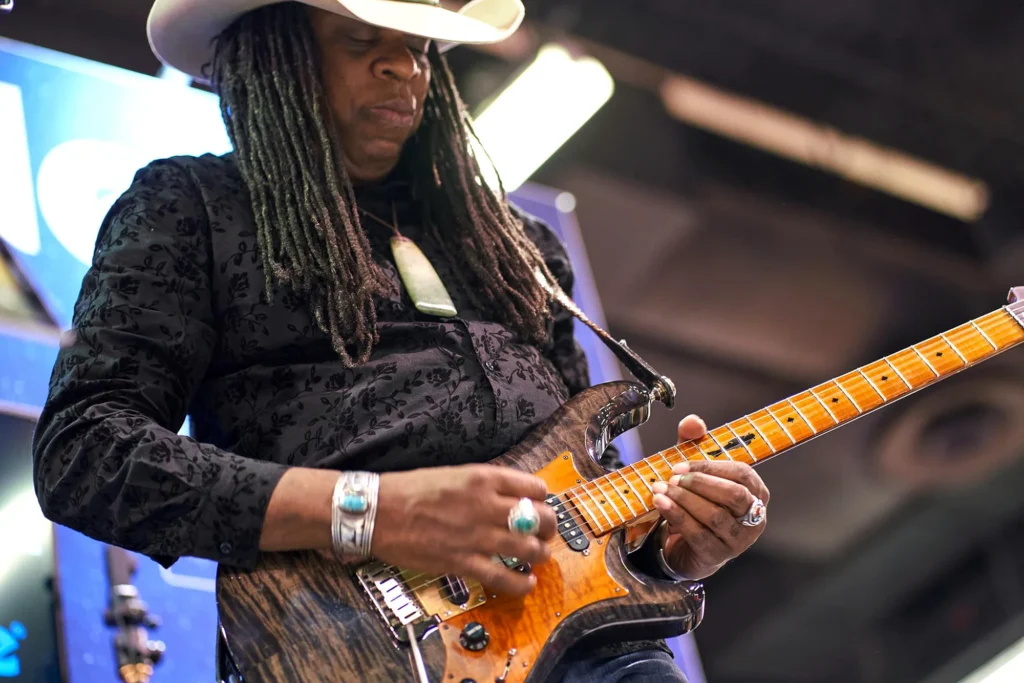 Guitarist photographed performing live at NAMM music conference