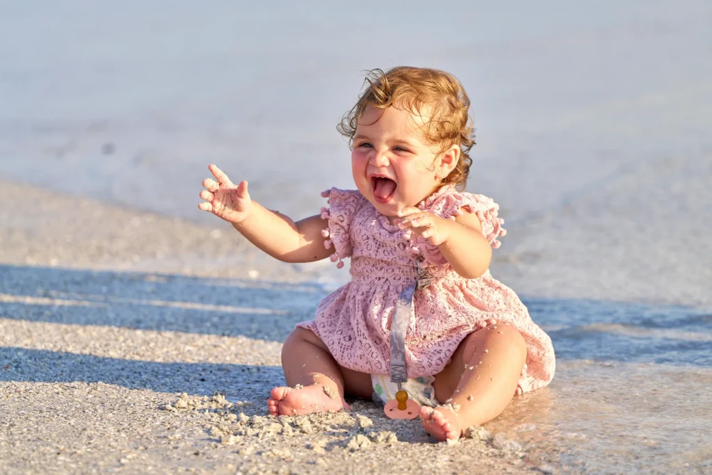 Beach Portrait of Cute Baby in Siesta Key Smiling in the Water Family Photographer