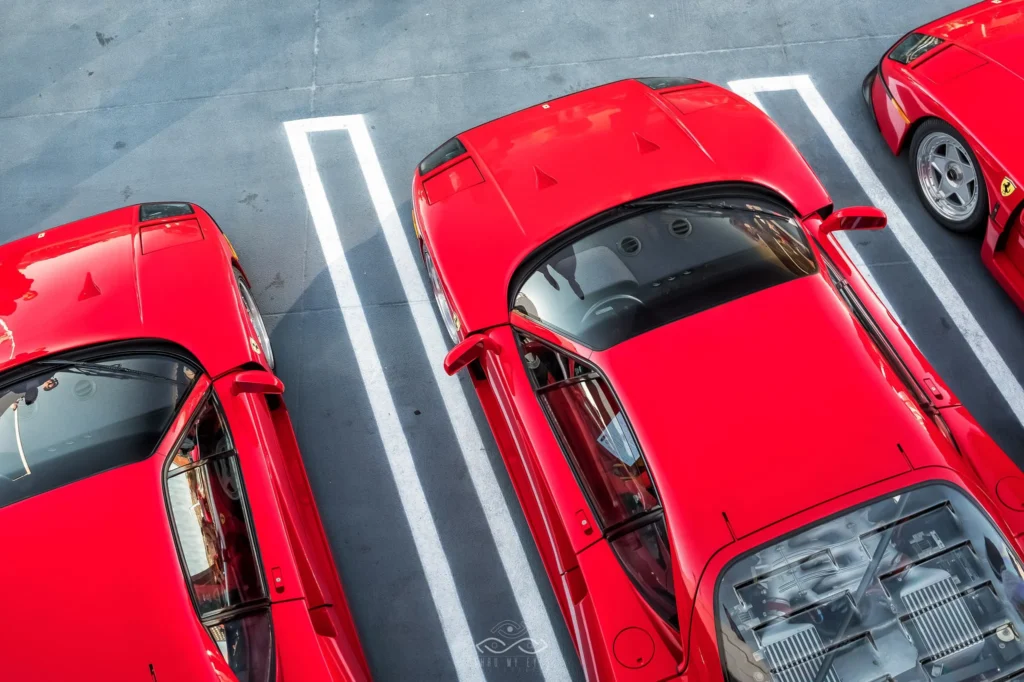 Automotive photograph of three red Ferrari F40s Lined Up