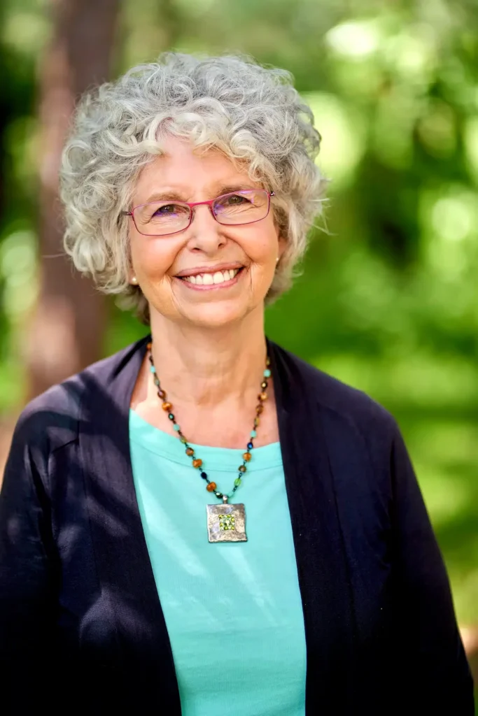 Portrait photography of woman author shaded by trees