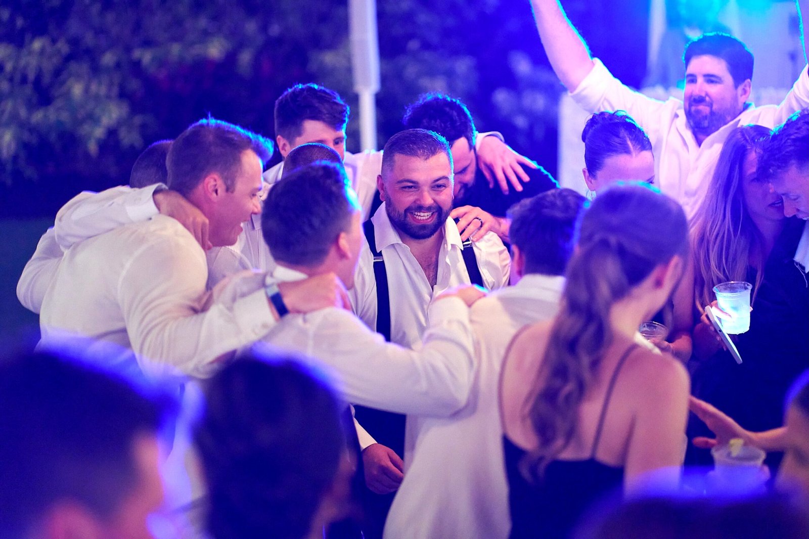 Event Photograph of group celebrating at Lido Key Sarasota wedding