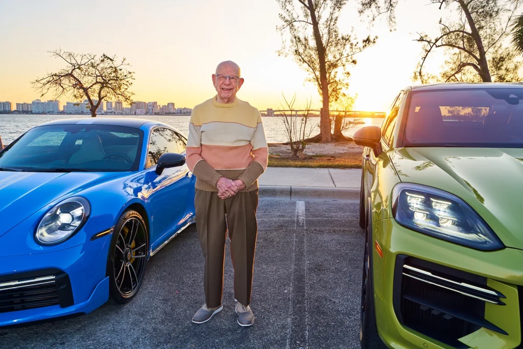 Portrait of Man Standing With Porsches in Sarasota Ringling Bridge Automotive Photographer