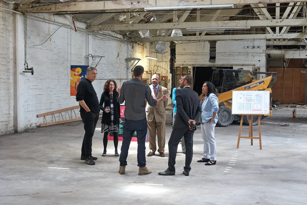 Professional event photo of group discussion and people talking