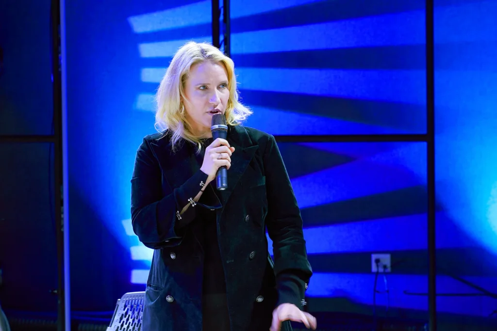 Photograph of woman keynote speaker at conference