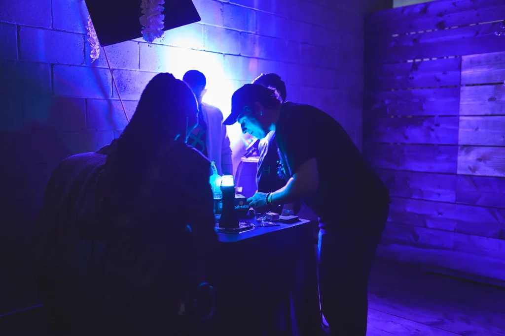 Event photography of dimly lit product demonstration