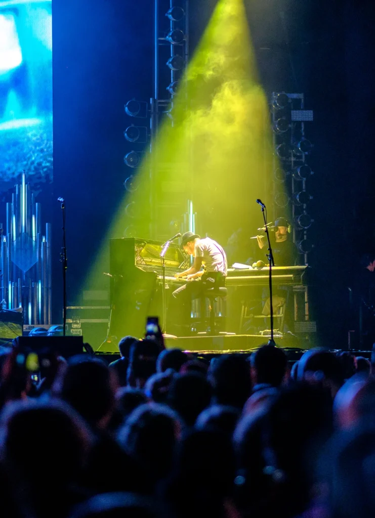 Portrait of musician playing piano live on stage at Lumineers concert