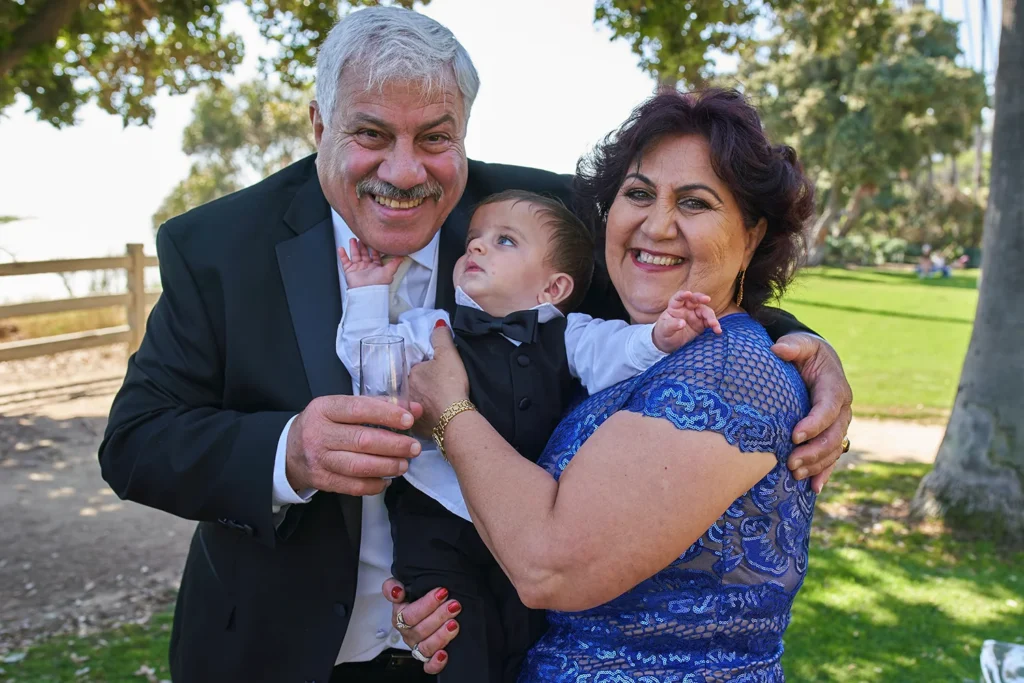 Joyful moment captured between family and children at outdoor Sarasota wedding
