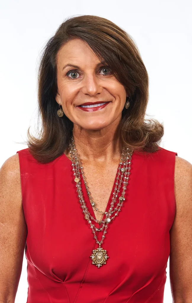 Professional business headshot photographer session of woman in red dress