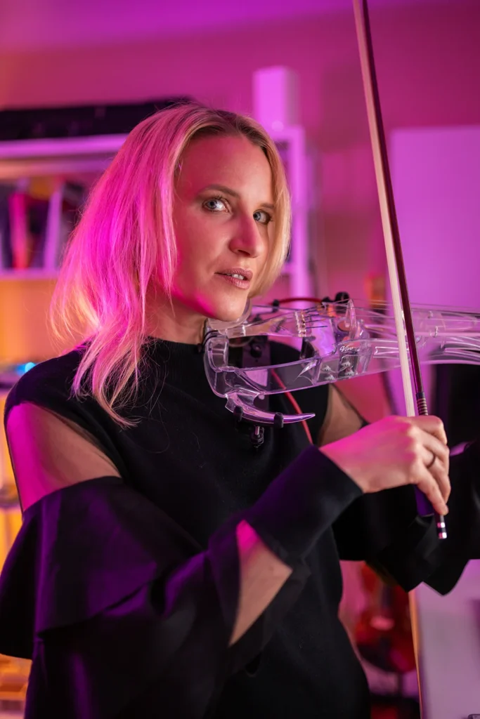 Female musician in studio with instrument for portrait photography session