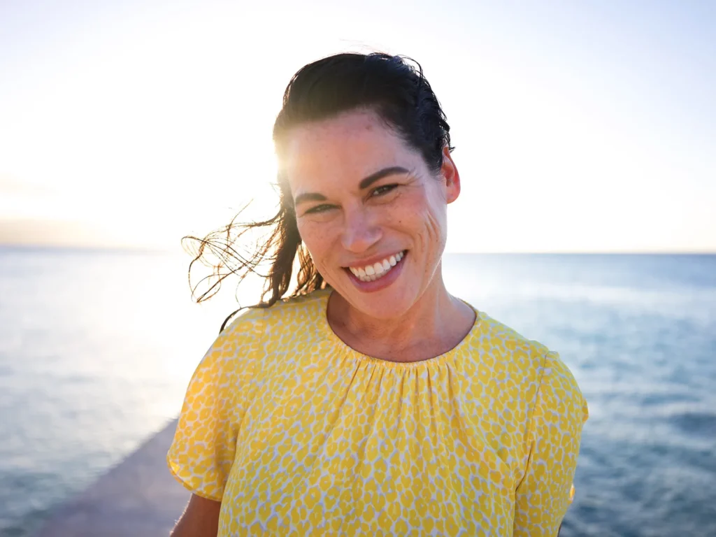 Sunset Beach Portrait of Model Smiling at Camera