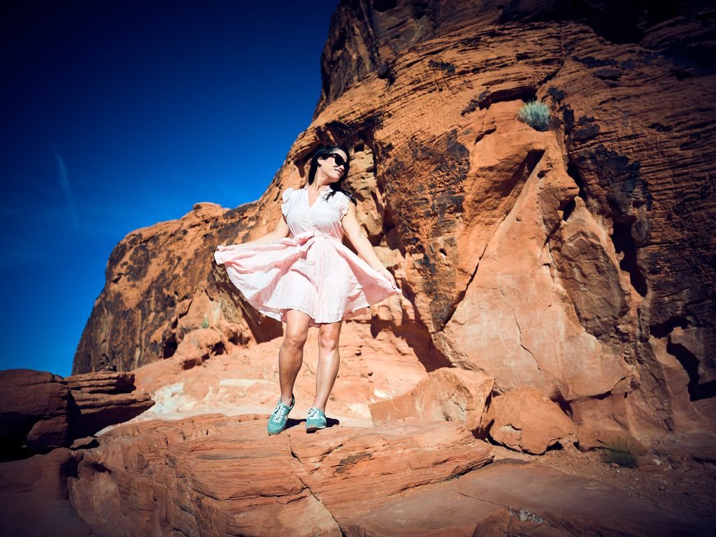Portrait Photographer Model Women on Rocks in Pink Dress